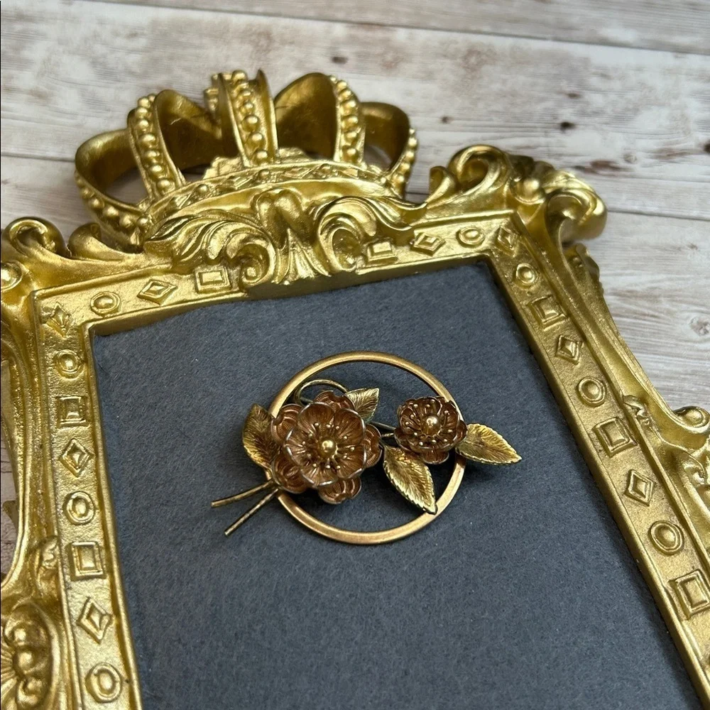 vintage Krementz brooch featuring floral designs in a mixed rose and yellow gold